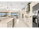Bright kitchen with stainless steel appliances and ample counter space and modern cabinetry at 3487 Recurve Cir, Sarasota, FL 34240