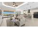 Spacious living room with an open layout, connecting the kitchen and outdoor living area for easy entertaining at 3487 Recurve Cir, Sarasota, FL 34240