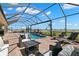 Covered patio area featuring an outdoor living space with comfortable seating and a view of the pool at 3487 Recurve Cir, Sarasota, FL 34240