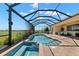 Inviting swimming pool and hot tub on a spacious, screened lanai with picturesque backyard views at 3487 Recurve Cir, Sarasota, FL 34240