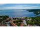 Aerial view of colorful coastal community with waterfront access and palm trees, set against the backdrop of the bay at 3735 42Nd S Way # J, St Petersburg, FL 33711