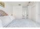 Bedroom featuring neutral colors, soft lighting, and plentiful closet space at 3735 42Nd S Way # J, St Petersburg, FL 33711