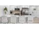 Modern kitchen features quartz countertop, stainless steel appliances, and barstool seating area at 3735 42Nd S Way # J, St Petersburg, FL 33711