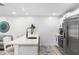 Modern kitchen featuring stone backsplash and stainless steel appliances, with plentiful counter space at 3735 42Nd S Way # J, St Petersburg, FL 33711