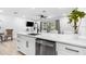 Open concept kitchen with island and lots of counter space and stainless steel appliances and bright lighting at 3735 42Nd S Way # J, St Petersburg, FL 33711