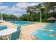 Enjoy this sparkling pool with lounge chairs and shade, perfect for relaxing and soaking up the sun on a beautiful day at 3735 42Nd S Way # J, St Petersburg, FL 33711