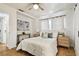 Stylish bedroom featuring parquet floors, neutral colors, and modern decor at 3818 W San Miguel St, Tampa, FL 33629