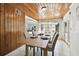 Bright dining room includes a wood ceiling, tile floors, and views to the backyard at 3818 W San Miguel St, Tampa, FL 33629