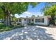 Charming single-story home featuring a well-manicured front yard and a beautiful brick driveway at 3818 W San Miguel St, Tampa, FL 33629
