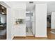 Galley kitchen featuring bright, white cabinets and eat in breakfast area at 3818 W San Miguel St, Tampa, FL 33629