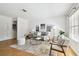 Cozy living room featuring hardwood floors, stylish furnishings, and ample natural light at 3818 W San Miguel St, Tampa, FL 33629