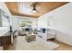This living room is well-lit, has a wood ceiling, and comfy couches at 3818 W San Miguel St, Tampa, FL 33629