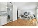 Inviting living room featuring hardwood floors with sight lines into the kitchen at 3818 W San Miguel St, Tampa, FL 33629