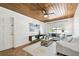 Inviting living room features a wood-planked ceiling, comfortable seating, and natural light at 3818 W San Miguel St, Tampa, FL 33629