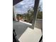 Balcony with a view of neighborhood houses and lush trees, offering space for outdoor relaxation at 4509 W North A St # 1, Tampa, FL 33609