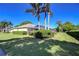 Manicured backyard featuring lush green grass, mature landscaping, and a private pool area at 4904 Breyer Wood Ct, Valrico, FL 33596