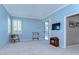 Cozy bedroom with light blue walls, sliding glass door, and plantation shutters at 4904 Breyer Wood Ct, Valrico, FL 33596