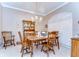 Traditional dining room features wooden furniture, chandelier lighting, and shuttered windows at 4904 Breyer Wood Ct, Valrico, FL 33596
