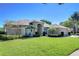 Charming home with a manicured lawn and mature landscaping at 4904 Breyer Wood Ct, Valrico, FL 33596