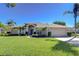 Charming single-story home with a well-manicured lawn, mature landscaping, and a spacious two-car garage at 4904 Breyer Wood Ct, Valrico, FL 33596
