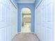 Hallway view of bathroom with a tub and shower through an arched doorway at 4904 Breyer Wood Ct, Valrico, FL 33596