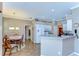 Open concept kitchen with white cabinets, stainless steel appliances and eat-in breakfast bar at 4904 Breyer Wood Ct, Valrico, FL 33596