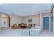 Comfortable living room with plush seating, neutral walls, and elegant arched entryway at 4904 Breyer Wood Ct, Valrico, FL 33596