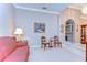 Cozy living room with soft lighting, comfortable seating, and a view into another room at 4904 Breyer Wood Ct, Valrico, FL 33596
