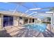Inviting pool area with a screened enclosure, perfect for enjoying the outdoors while staying cool and comfortable at 4904 Breyer Wood Ct, Valrico, FL 33596