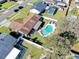 Aerial view showing a home with a pool, patio, and a fenced backyard with mature trees at 808 Centerwood Ct, Brandon, FL 33511