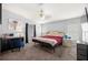 Bedroom with a red comforter, desk, makeup table, and television at 8632 Fantasia Park Way, Riverview, FL 33578