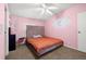 Cozy bedroom with a plush bed and carpet flooring at 8632 Fantasia Park Way, Riverview, FL 33578