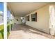 Covered carport area featuring ample space, views to the side yard, and access to the home's side entrance at 8632 Fantasia Park Way, Riverview, FL 33578