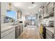 Bright kitchen featuring white and gray cabinetry, water views and an opening to the patio at 8632 Fantasia Park Way, Riverview, FL 33578