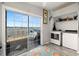 Laundry room with water view from sliding glass doors to the patio at 8632 Fantasia Park Way, Riverview, FL 33578