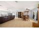 Spacious living room featuring a large leather sofa, hardwood floors, and ample natural light at 8632 Fantasia Park Way, Riverview, FL 33578