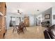 Living room with hardwood floors, a dining area with furniture, and view to the kitchen at 8632 Fantasia Park Way, Riverview, FL 33578