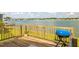 Water view from the outdoor patio and a blue grill at 8632 Fantasia Park Way, Riverview, FL 33578