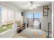Bright sunroom with patio access and natural light at 8632 Fantasia Park Way, Riverview, FL 33578