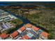 An aerial view of the community showcasing river access and nearby waterways at 9980 Eagles Point Cir # 1, Port Richey, FL 34668