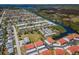 Aerial view of residential area with waterfront, canals and orange roofs at 9980 Eagles Point Cir # 1, Port Richey, FL 34668