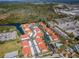 A high-angle shot shows the layout of the community with water views at 9980 Eagles Point Cir # 1, Port Richey, FL 34668