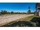 An angled view of the property bordering the backyard and cement wall at 9980 Eagles Point Cir # 1, Port Richey, FL 34668