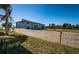 Backyard view with a cement wall that borders the back of the property at 9980 Eagles Point Cir # 1, Port Richey, FL 34668