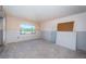 Bright bedroom with window and tile floors ready to be renovated at 9980 Eagles Point Cir # 1, Port Richey, FL 34668