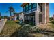 Exterior angle showing the patio, outdoor storage, and yard at 9980 Eagles Point Cir # 1, Port Richey, FL 34668