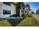 Exterior shot showcasing the back of the home, patio, and air conditioning unit at 9980 Eagles Point Cir # 1, Port Richey, FL 34668