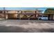 Condominium building featuring covered parking and stone accents at 9980 Eagles Point Cir # 1, Port Richey, FL 34668