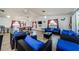 Bright common area with wicker seating and a game table at 9980 Eagles Point Cir # 1, Port Richey, FL 34668