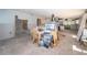 Bright open-concept with tile flooring and a view into the kitchen; primed for customization at 9980 Eagles Point Cir # 1, Port Richey, FL 34668